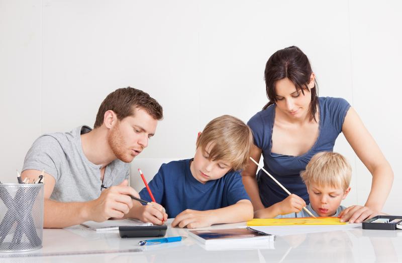 Parents helping their children with homework